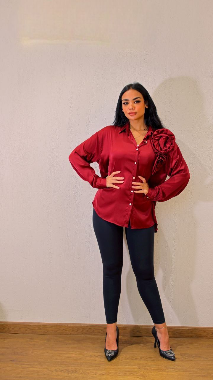 Soft satin shirt featuring a stylish flower accent
