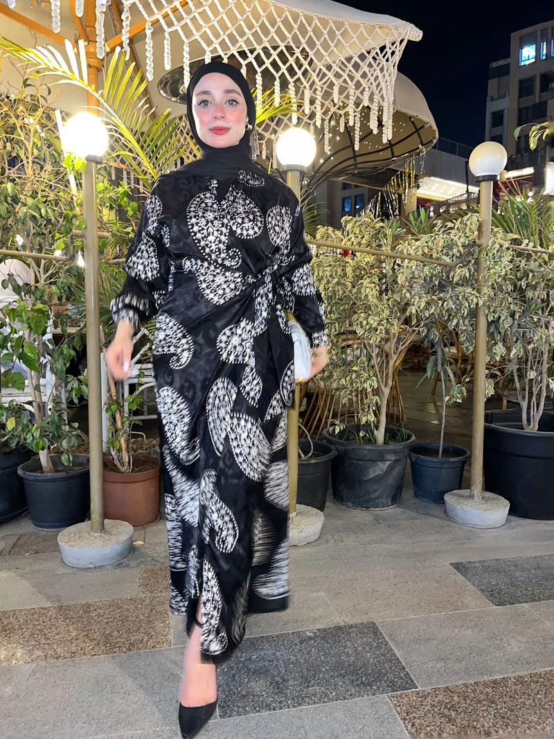 Shine in this elegant printed satin dress with a soft belt detail