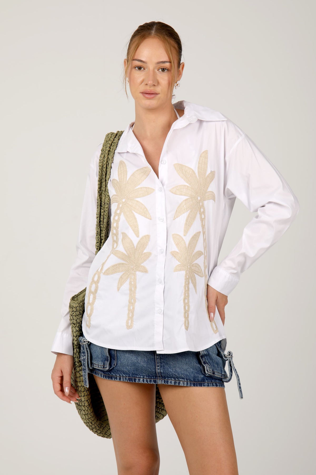 This shirt with palm tree embroidery gives off a fresh, tropical vibe perfect for summer days