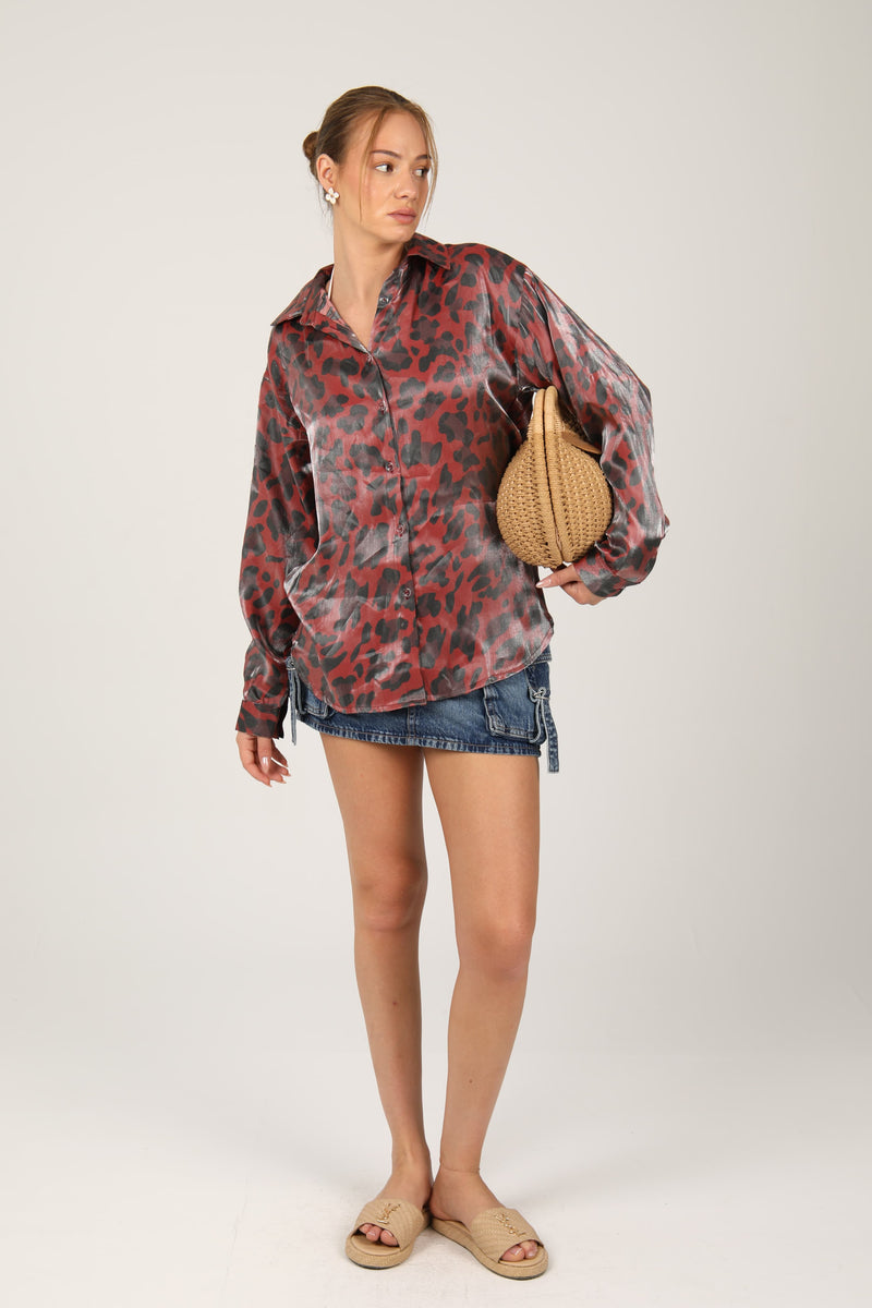 This leopard print shirt with a silky sheen effortlessly combines wild charm with polished elegance