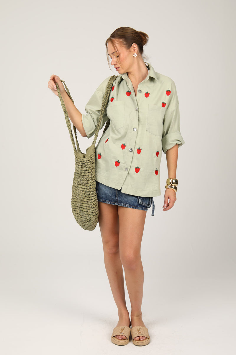 Casual shirt adorned with red strawberry embroidery for a fresh and playful look
