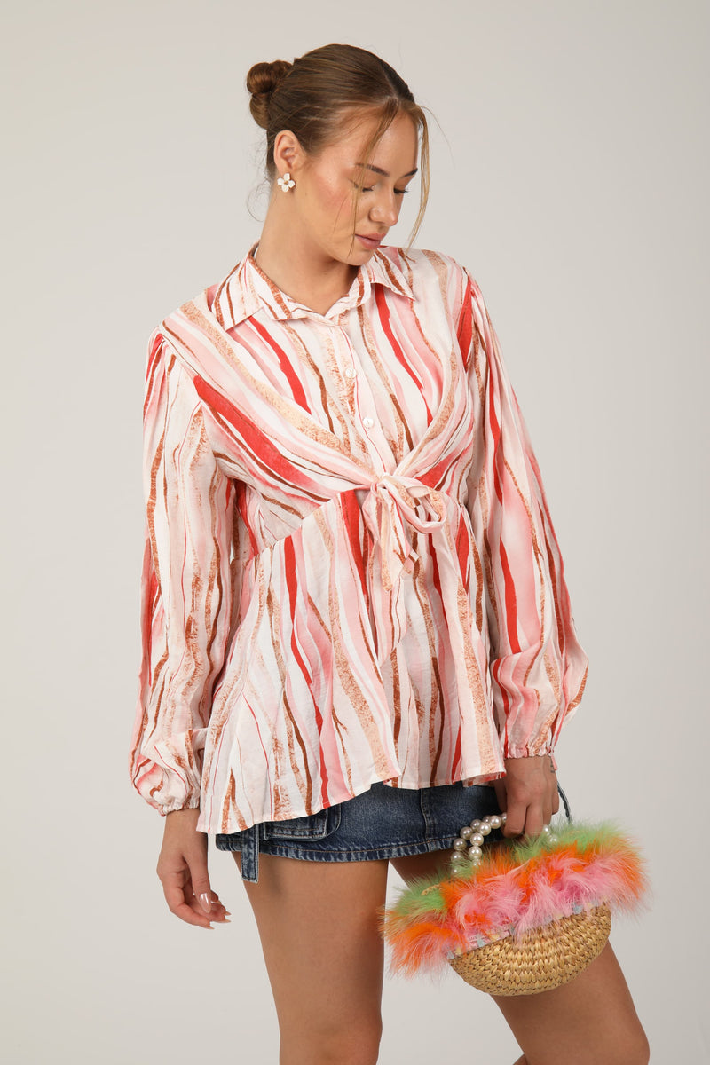 This striped blouse with balloon sleeves and a front tie design adds a fun and trendy vibe to your outfit