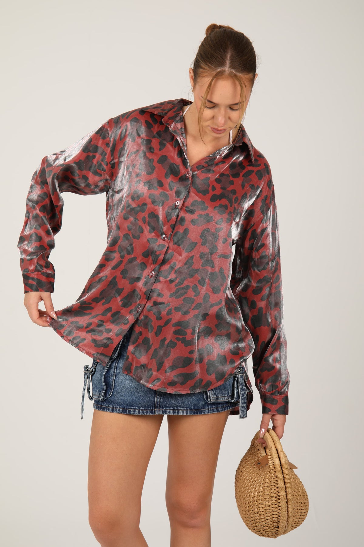 This leopard print shirt with a silky sheen effortlessly combines wild charm with polished elegance