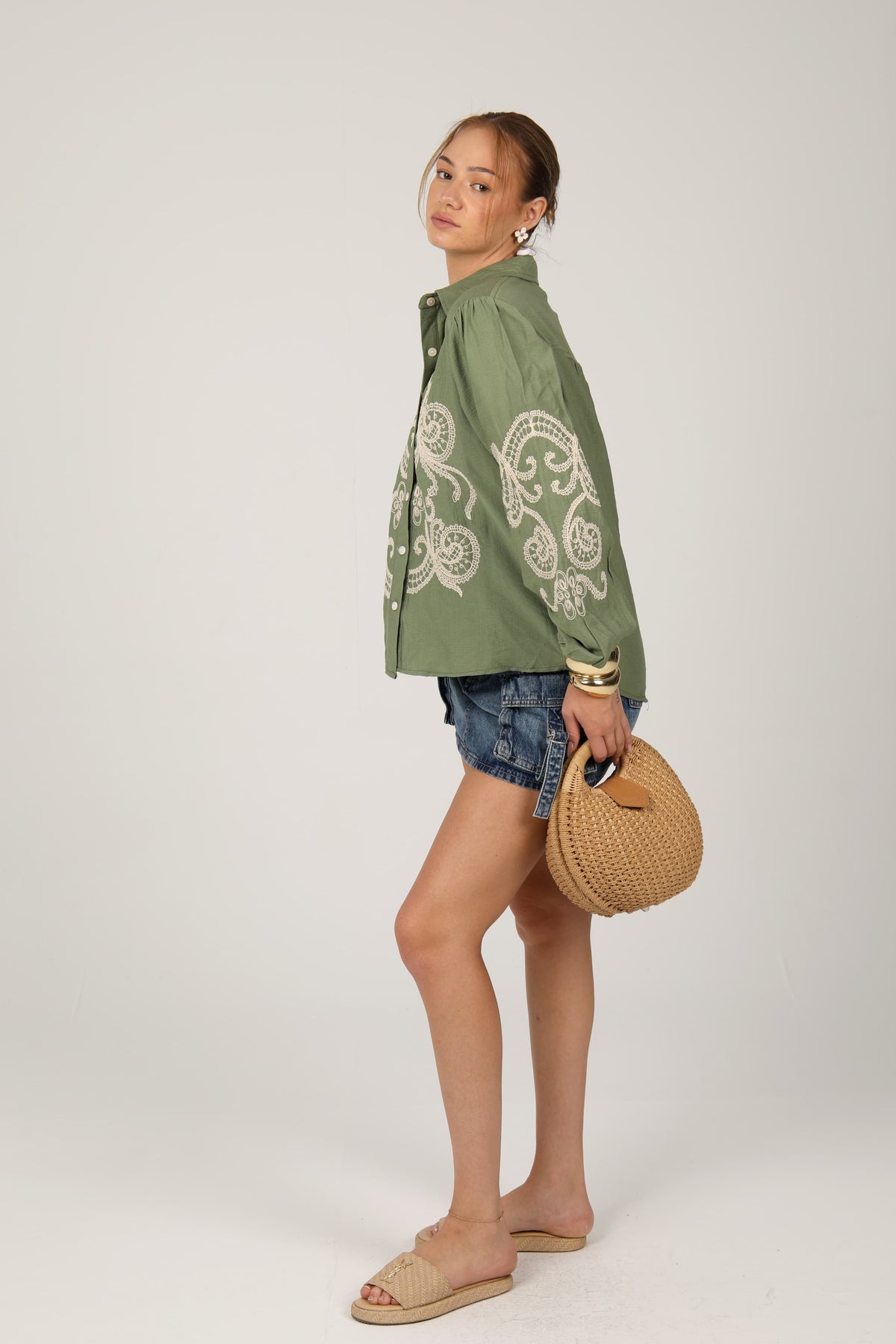 This embroidered shirt blends bohemian charm with modern flair, perfect for adding a statement to your everyday look