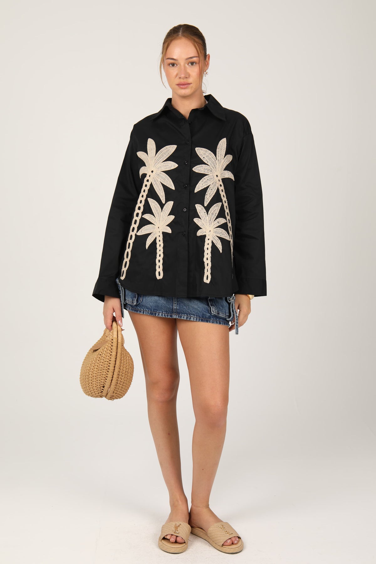 This shirt with palm tree embroidery gives off a fresh, tropical vibe perfect for summer days