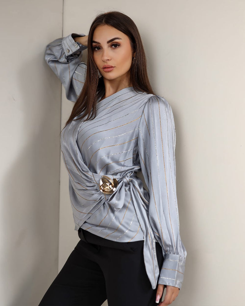 A striped satin blouse that adds effortless elegance