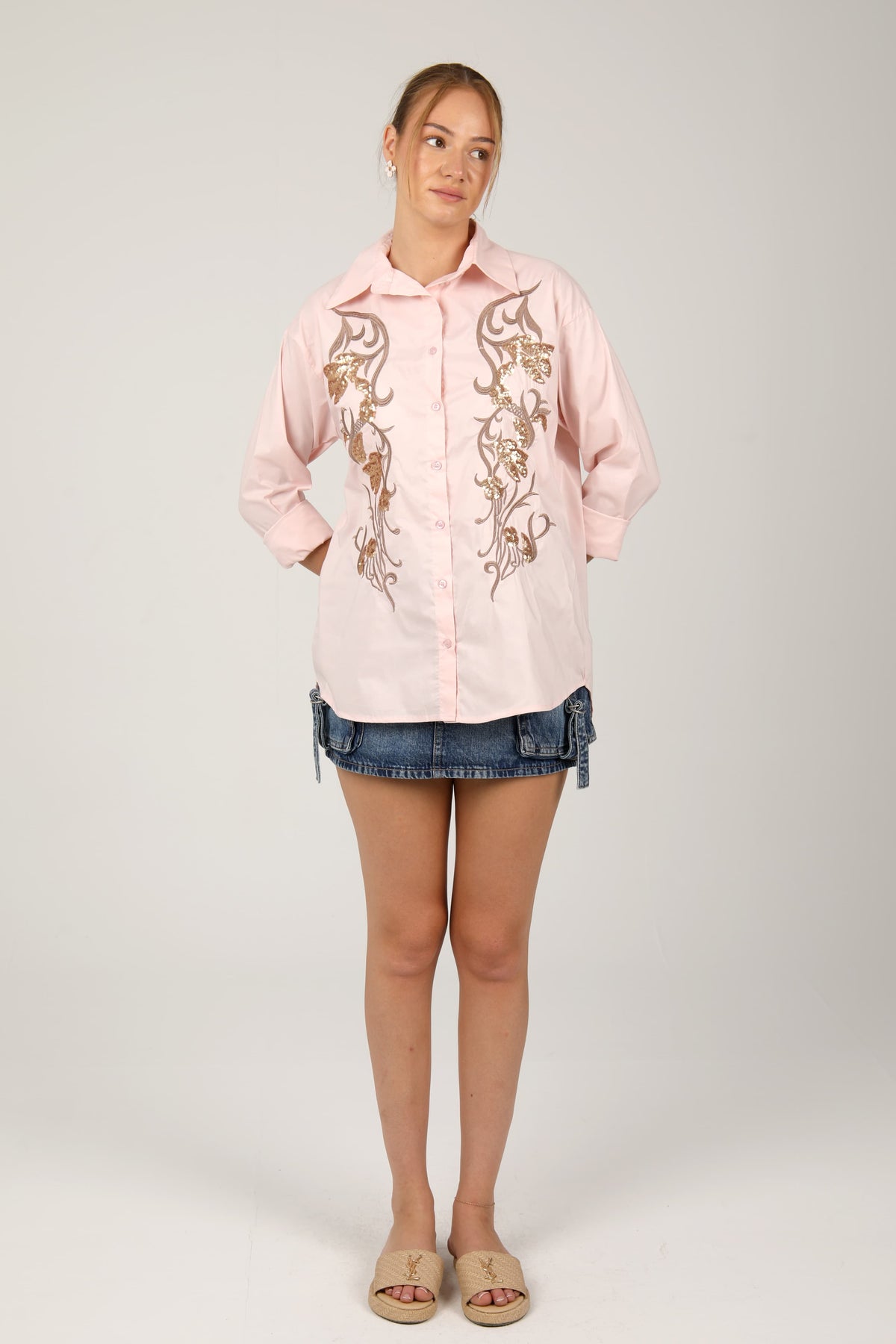 This  shirt with golden embroidery brings a touch of elegance and charm to your casual style.