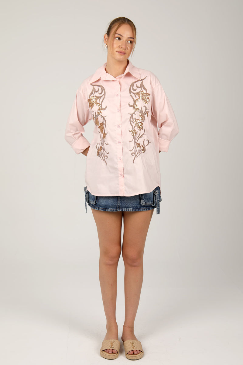 This  shirt with golden embroidery brings a touch of elegance and charm to your casual style.