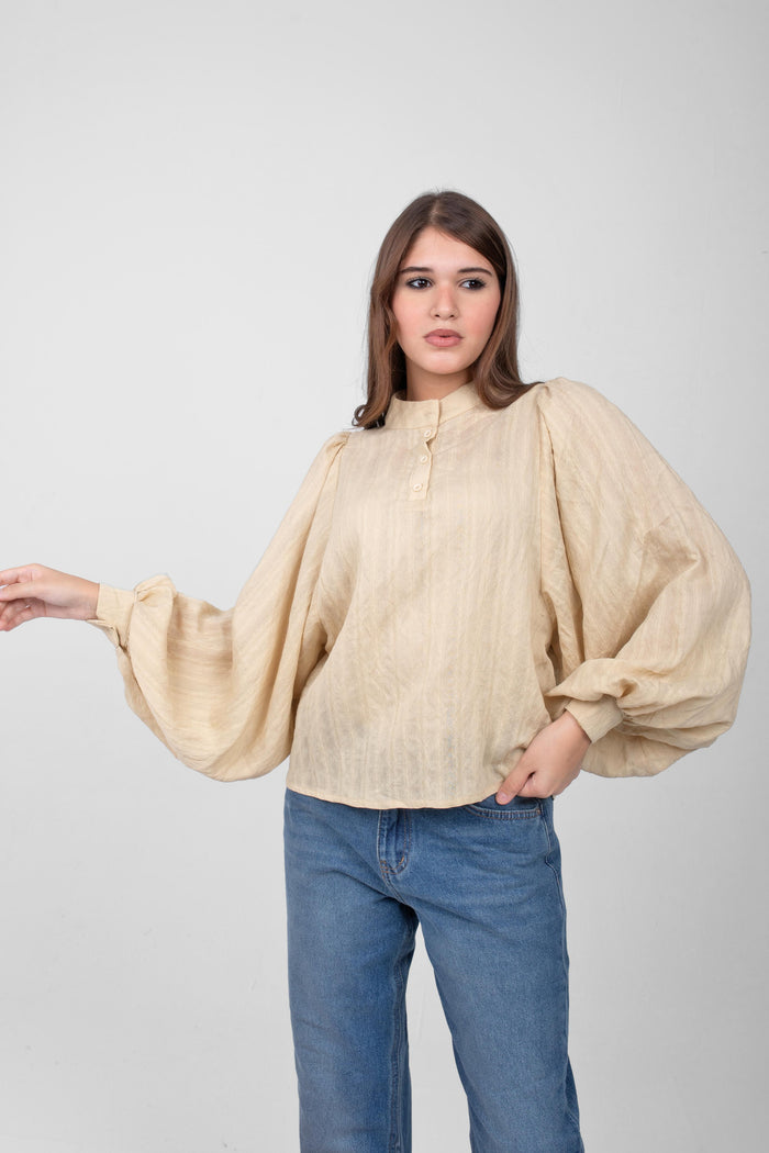 Flow in style with this wide-sleeve linen blouse