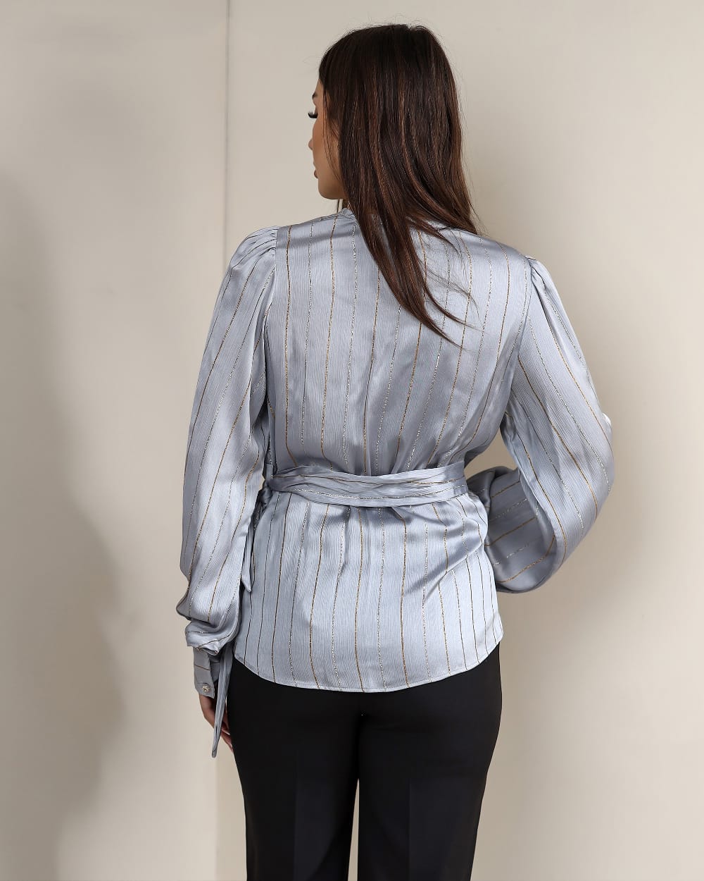 A striped satin blouse that adds effortless elegance