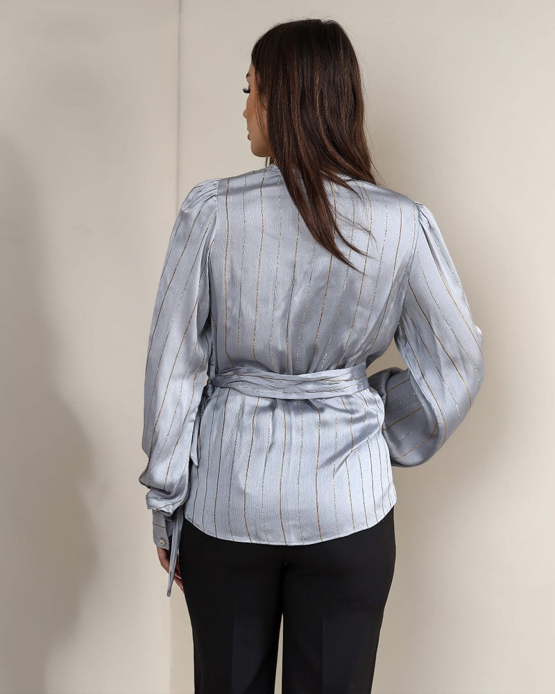 A striped satin blouse that adds effortless elegance
